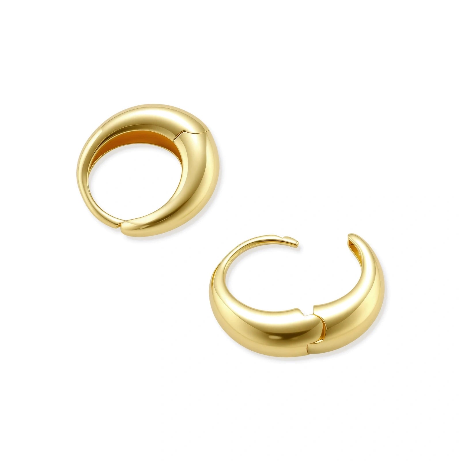 Chunky gold-plated sterling silver huggie hoop earrings with hinged closure mechanism on cream background.