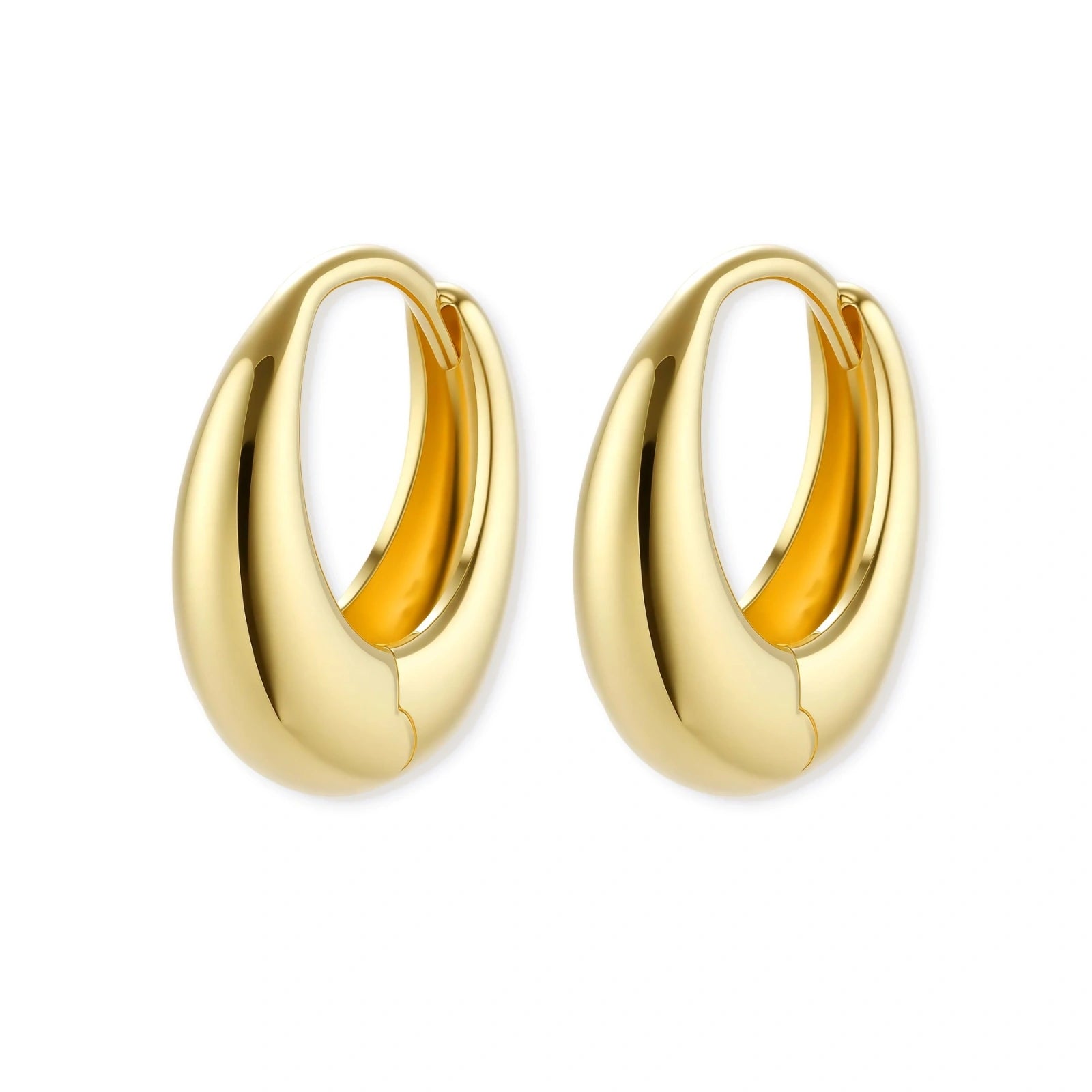 Chunky gold-plated sterling silver huggie hoop earrings with hinged closure mechanism on cream background.