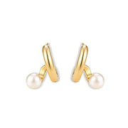 Pair of gold-plated sterling silver swirl hoop earrings with a round freshwater pearl, shown on a cream background.