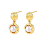 Gold-plated sterling silver drop earrings with a ribbed oval stud top and a freshwater pearl in a molten-textured gold frame.