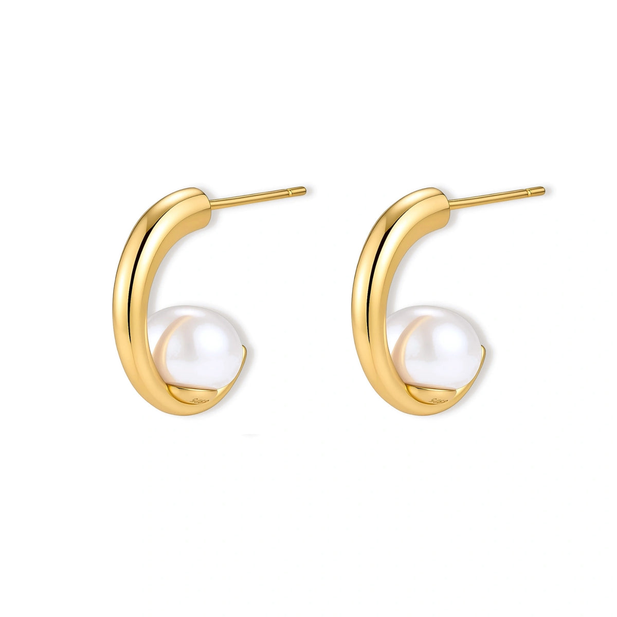 Pair of gold-plated sterling silver half-hoop earrings, each cradling a round white simulated pearl, on a cream background.