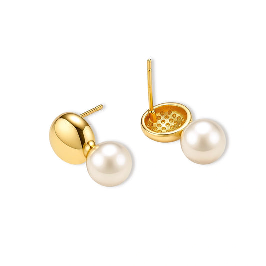 Pair of 18K gold-plated sterling silver stud earrings with a glossy gold dome stacked above a round simulated pearl on cream.