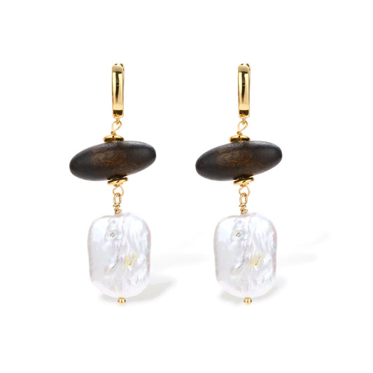 Gold hoop earrings with dark wood beads and baroque freshwater pearls, shown from multiple angles on cream background.