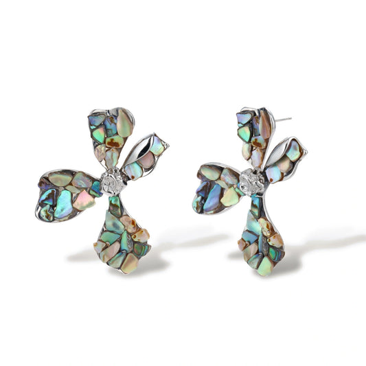 Cross-shaped stud earrings with iridescent abalone shell mosaic in blues and greens, silver-plated setting with crystal center