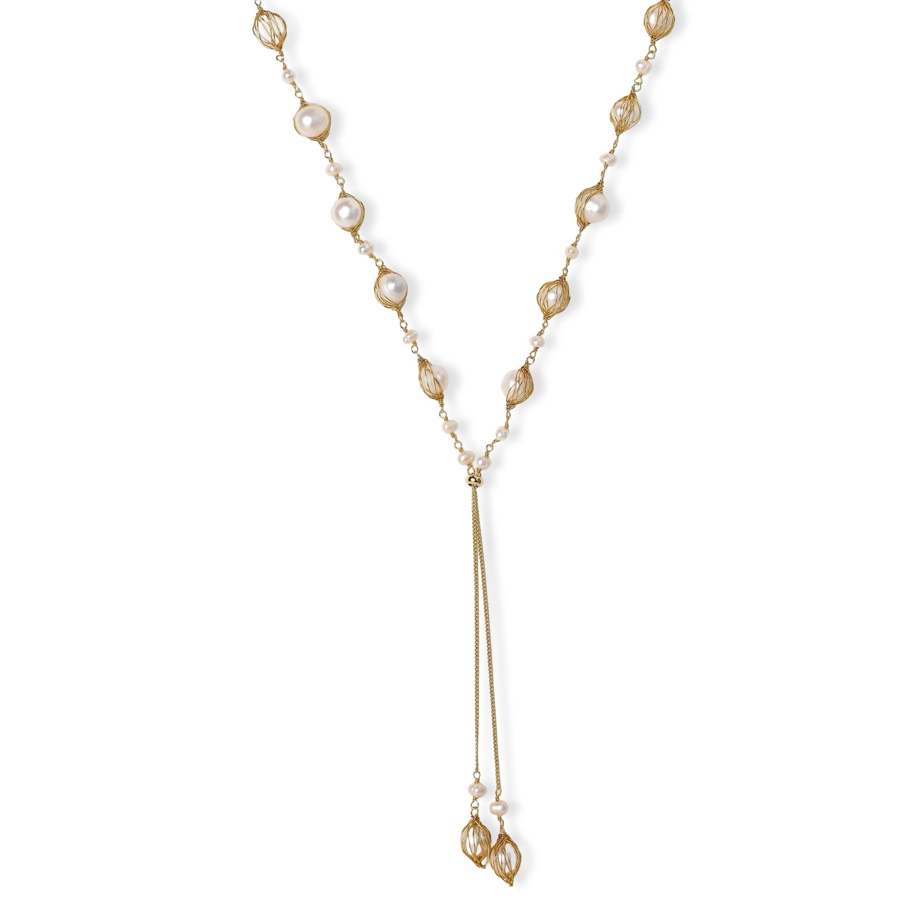 Adjustable gold lariat necklace with freshwater pearls nested in delicate cage settings and Y-shaped tassel drop