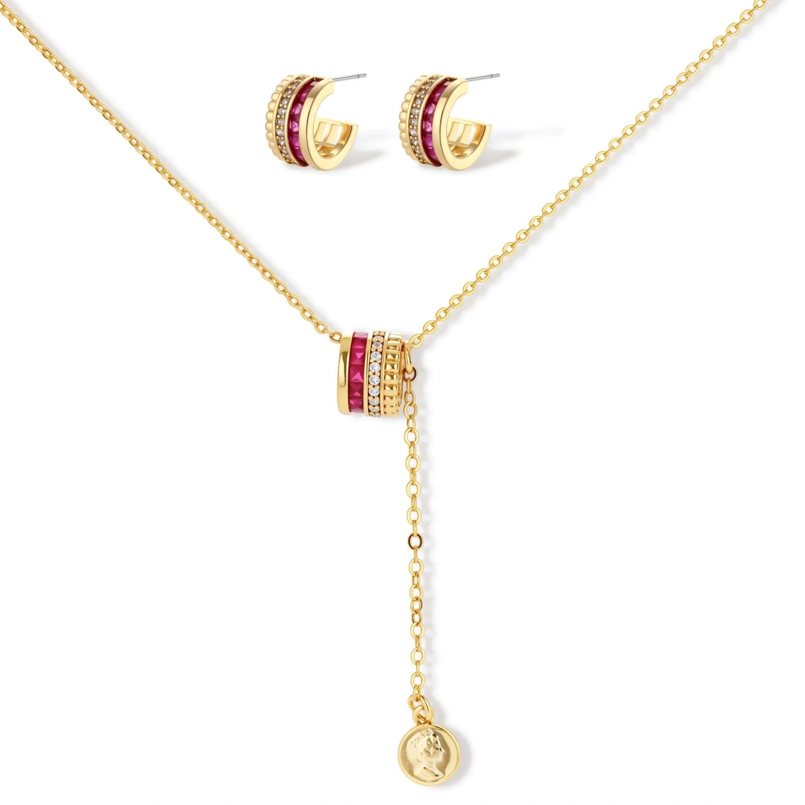 Three-piece jewelry set featuring 14K gold plated pieces with deep red cubic zirconia stones and clear crystals on cream background.