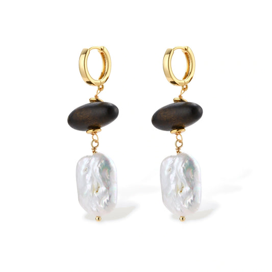 Gold hoop earrings with dark wood beads and baroque freshwater pearls, shown from multiple angles on cream background.