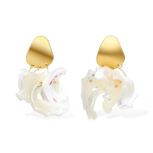 Gold-plated copper earrings with organic pebble studs and natural shell drops on cream background.