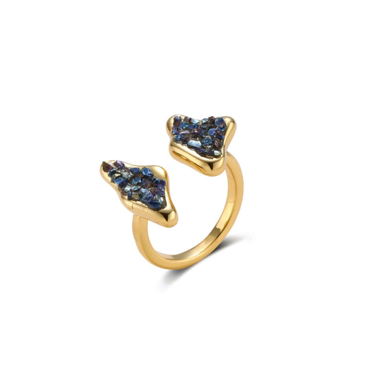 Adjustable gold-plated open cuff ring featuring clustered blue natural stones at each end on neutral background.