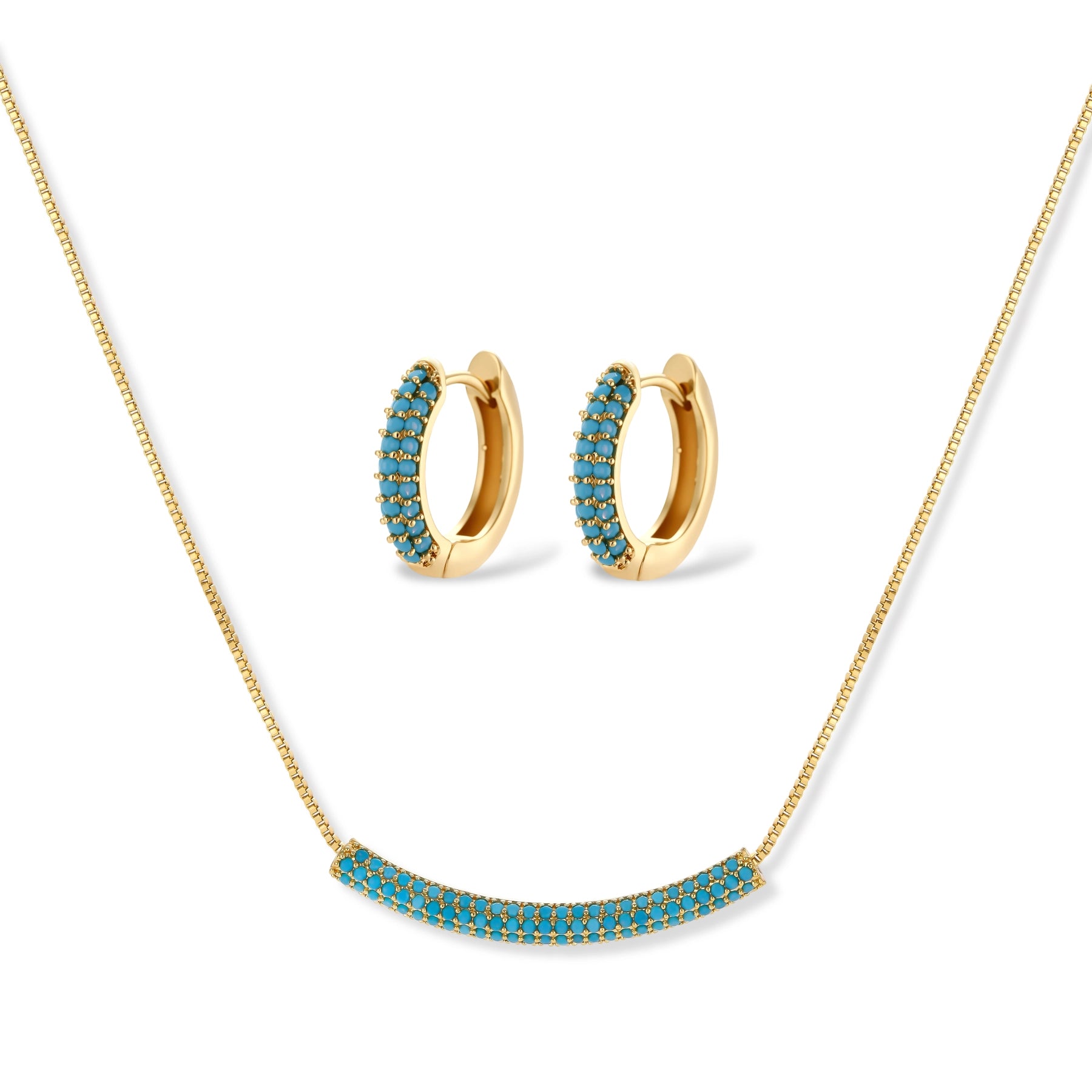 Gold-plated curved necklace and hoop earrings with turquoise cubic zirconia stones on white background.