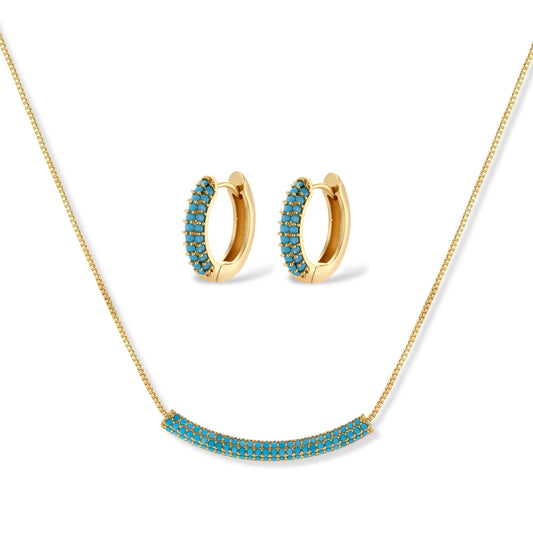 Gold-plated curved necklace and hoop earrings with turquoise cubic zirconia stones on white background.